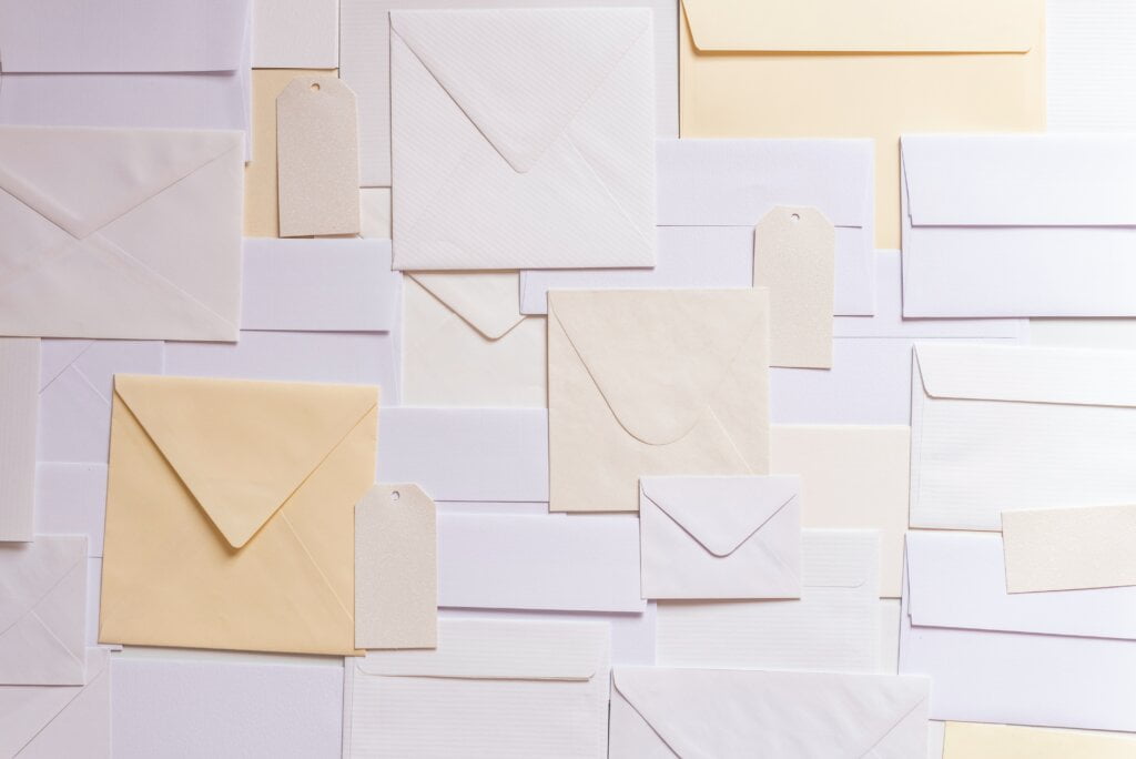 Various sized envelopes, white and beige
